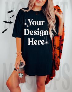 a woman wearing a black t - shirt with the words your design here on it