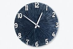 a blue clock with white numbers on it