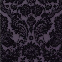 an ornate black and purple wallpaper with floral design on the bottom, it is very dark