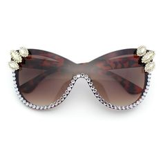 These bold, glitzy rhinestone jewel studded flashy sunglasses are perfect for the true diva! They are made with oversized 100% UV400 polycarbonate lenses for a maximum facial coverage and celeb vibe, and they have a plastic frame and metal hinges for durability. The rhinestones and rimless construction add a maximum glamor and glitz to the piece. (c388) Size: 5 7/8" (149mm) x 2 3/8" (60mm).  Color: Brown.  Gender: female.  Age Group: adult. Brown Plastic Party Sunglasses, Chic Sunglasses, Plastic Sunglasses, Metal Hinges, Rimless Sunglasses, Rhinestone Heart, Gold Sunglasses, Designer Sunglasses, Fashion Sunglasses