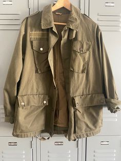 Khaki Military Jacket Unisex Size M/L (I'm a small but I like to wear it oversized) Thrifted in LA Very good condition Oversized Khaki Outerwear With Flap Pockets, Oversized Military Outerwear With Pockets, Oversized Khaki Utility Jacket With Multiple Pockets, Oversized Khaki Outerwear With Patch Pockets, Oversized Military Utility Jacket With Pockets, Vintage Spring Outerwear With Multiple Pockets, Oversized Military Utility Jacket, Vintage Oversized Outerwear With Pockets, Vintage Outerwear With Cargo Pockets For Work