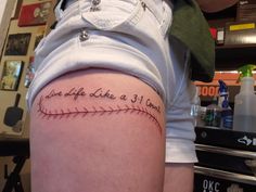 a woman with a baseball tattoo on her thigh and the words, one day she'll be a 31 year old