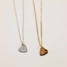 This delicate Minima heart-shaped necklace is a subtle yet bold expression of love. Minima hearts are tiny and precious, yet still make the biggest impact whenever they're worn. Wear it alone, or create your own personal necklace by stacking up with more heart charms and initials. Product Details: Material: 14k Gold Filled, Sterling silver, Rose gold filled 0.3" heart charm Production Time: Your pieces are handmade with care and love; they also take time to produce. Please allow 8- 12 business d Small Heart Necklace, Mama Necklace, Heart Shaped Pendant Necklace, Hand Stamped Necklace, Heart Shaped Necklace, Meaningful Jewelry, Hand Stamped Jewelry, Silver Heart Necklace, Heart Shape Pendant