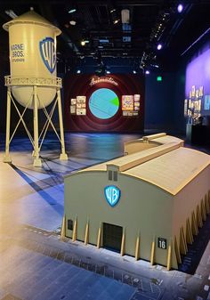 Warner Bros. Studio Tour inside Storytelling Showcase 3-D Replica of tallest sound stage in North America with the WB logo on it as seen in opening scenes of WB productions along with WB water tower La Aesthetic, Tv Production, Burbank California, Warner Brothers