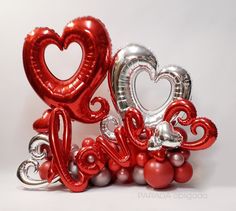 red and silver balloons with the word love spelled out