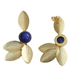 These beauties have hand brushed gold leaves with a deep-blue lapis lazuli gemstone. handcrafted by artisans 18k gold plate over nickel free brass genuine stone push backs Gold Earrings With Natural Lapis Lazuli Stones, Elegant Gold Lapis Lazuli Earrings, Handmade Gold Lapis Lazuli Earrings, Gold Lapis Lazuli Earrings As Gift, Gold Lapis Lazuli Earrings For Gift, Handmade Gold Earrings With Lapis Lazuli, Gold Lapis Lazuli Jewelry Set With Earrings, Lapis Lazuli Earrings, Gold Leaf Earrings