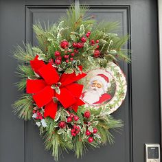 a christmas wreath hanging on the front door