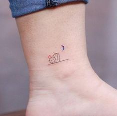 small cactus tattoo on ankle with crescent moon and star in the sky above it,