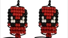 two red, white and black beaded earrings