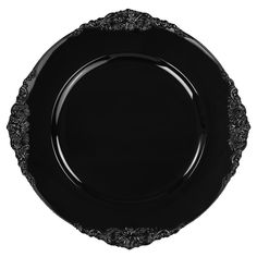 an empty black plate with ornate designs on the rim and sides, isolated against a white background