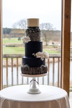 a three tiered cake sitting on top of a table