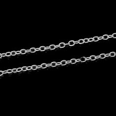 a silver chain on a black background