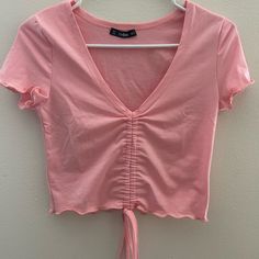 Pink Shein Cinched Top With Lettuce Hem Nwot, Never Worn Adjustable Strings Down The Center Of The Front Of The Shirt Lettuce Hem Size S All Items Will Be Washed Before Being Shipped Out! Bundle To Save On Shipping, And Receive A Discount When You Buy 2 Or More Items! :) Casual V-neck Top With Drawstring, V-neck Drawstring Top For Spring, Spring V-neck Drawstring Top, Spring V-neck Top With Drawstring, Fitted Pink Tops With Drawstring, Fitted Pink Top With Drawstring, Pink Ruched Cotton Top, Cinched Top, Crop Top Designs