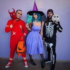 three people dressed up in halloween costumes