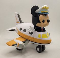 a toy airplane with a mickey mouse on it