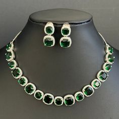 Emerald CZ diamond Necklace, Indian Pakistani wedding Jewelry, Mother of the Bride, Crystal Necklace, Bridesmaid, Gift for her  Gorgeous Emerald CZ Set in aaa quality CZ stones. This American Diamond Necklace Set comes with a pair of earrings. Necklace length 16 inches and shortened to 15 inches  Earrings Length approx 1 inch Regular size and adjustable Arrives in a gift box. Highest quality and craftsmanship Ready to ship from California, United States and delivery in 3-5 days in US Please let me know if you have any questions. Thank you so much for visiting my shop. Color, shades, and texture displayed may slightly vary from the actual product due to digital image limitations. We request you to consider these minor variations. Please expect the possibility of some slight imperfections wh Gift Bridal Sets With Diamond Cut Crystal, Green Sparkling Stones Jewelry Sets For Wedding, Elegant Green Jewelry Sets With Rhinestones, Elegant Green Rhinestone Jewelry Sets, Emerald Wedding Necklace With Diamond Cut, Green Diamond Cut Necklaces For Wedding, Green Diamond Cut Necklace For Wedding, Silver Emerald Jewelry Sets For Wedding, Green Diamond-cut Necklaces For Weddings