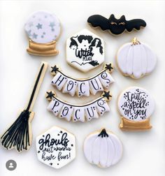 decorated cookies with black and white lettering on them are arranged in the shape of witches