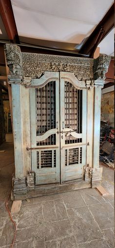 an old wooden door with iron bars on the top and bottom, is being worked on