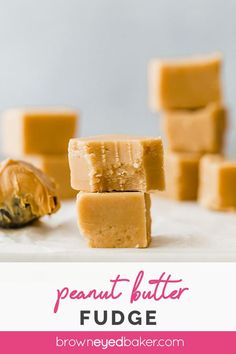 several pieces of peanut butter fudge stacked on top of each other in front of the rest of the block