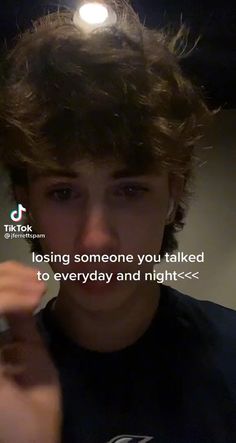 a young man holding a cell phone up to his face with the caption losing someone you talked to everyday and night - time