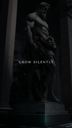 a statue with the words grow silently in front of it