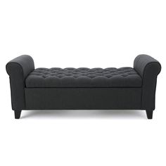 a gray couch with buttons on the armrests and foot rest in front of a white background