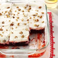 a glass dish filled with dessert sitting on top of a table