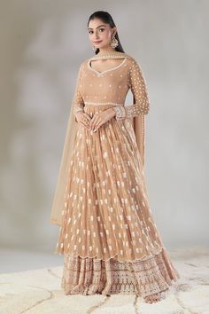 Beige anarkali with white floral embroidered buttis. Comes with coordinating embroidered sharara and bordered dupatta. - Aza Fashions Anarkali Sharara With Intricate Embroidery In Maxi Length, Bollywood Style Maxi Length Sharara With Intricate Embroidery, Beige Anarkali Gown With Sheer Dupatta, Beige Gown With Zari Work, Traditional Chikankari Embroidery Lehenga Maxi, Beige Anarkali Set With Intricate Embroidery And Traditional Drape, Diwali Maxi Length Sharara With Intricate Embroidery, Bollywood Style Designer Gown In Beige, Bollywood Style Beige Gown For Designer Wear