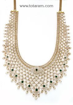 18 karat gold diamond long necklace with color stones & south sea pearls
  this product has inter changeable stones in the necklace and pendant. 

     

introducing our exquisite 18 karat gold diamond long necklace with color stones & south sea pearls, a true masterpiece that combines elegance and craftsmanship. handcrafted in india by totaram jewelers, this necklace is a symbol of luxury and sophistication.
  
  with its interchangeable stones, this necklace offers versatility and allows you t 22k Gold Green Jewelry For Anniversary, Green 22k Gold Jewelry For Anniversary, Classic Gold Hand Set Necklace, Classic Gold Necklace With Hand Set, Exquisite Gold Bridal Necklace With 17 Jewels, Gold Diamond Temple Necklace For Wedding, Classic Hand Set Gold Necklace, Gold Hand-set Emerald Necklace For Anniversary, Gold Emerald Necklace With Diamond Accents For Anniversary