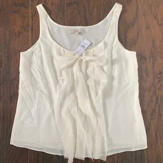 Nwt. Loft Women’s Cami/Tank W Accent Ruffle Down Center & Bow Size Medium Color Ivory Elegant Cream Tank Top For Summer, Cream Tank Camisole For Spring, Cream Tank Top For Spring, Spring Cream Tank Top, Elegant Cream Tank Top, Cream Summer Vest Top, Cream Vest Top For Summer, Color Ivory, Cami Tanks