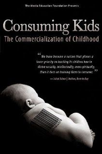 the book cover for consuming kids, with a baby's head on top of it