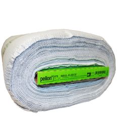 a roll of white fabric sitting on top of a green and white object with the word pellon printed on it