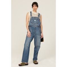 Blue denim (100% Cotton). Overalls. Pull on. 29" inseam. Imported. Everyday Medium Wash Relaxed Fit Denim Jumpsuit, Relaxed Fit Medium Wash Denim Jumpsuit For Everyday, Everyday Relaxed Fit Medium Wash Denim Jumpsuit, Utility Blue Denim Jumpsuit, Blue Denim Utility Jumpsuit, Washed Blue Denim Jeans For Work, Washed Blue Denim Jeans For Workwear, Levi's Denim Blue Workwear Jeans, Levi's Denim Blue Jeans For Workwear