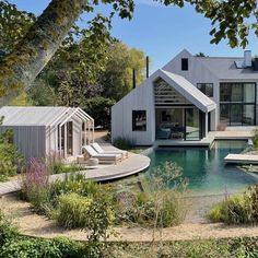 a house with a pool in front of it