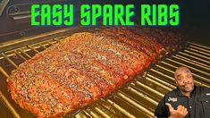 a man standing in front of an open grill with ribs on it and the words easy spare ribb