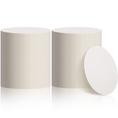 an image of two white vases next to each other