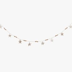 a white wall with stars hanging from it