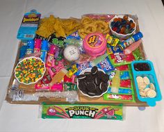 an assortment of candy and snacks on a table