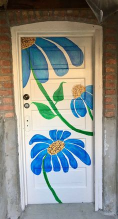 a white door with blue flowers painted on it