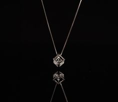 This pair of earring features a sterling silver Cube enclosing a cubic Zirconia diamond in it. + Sterling Silver + Cubic Zirconia stone + Chain measure 18 inch long + Come in gift ready package Please feel free to check out other Polyhedron necklace and earrings design below: https://www.etsy.com/listing/1031376809/geometry-necklacepolyhedron-necklacemath?ref=shop_home_recs_71&frs=1 https://www.etsy.com/listing/1031373877/geometry-earringspolyhedron-earringsmath?ref=shop_home_active_3&frs=1 http Square Pendant Diamond Cut Necklace As Gift, Formal Square Pendant Box Chain Jewelry, Diamond Box Chain Necklace For Gift, Diamond White Box Chain Necklace As Gift, Diamond White Box Chain Necklace For Gift, Anniversary Jewelry With Square Pendant And Box Chain, Formal Diamond White Jewelry With Box Chain, Cubic Zirconia Box Chain Necklace As Gift, Cubic Zirconia Box Chain Necklace For Gift