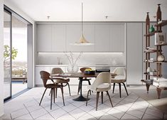 a dining room table and chairs in front of an open kitchen with sliding glass doors