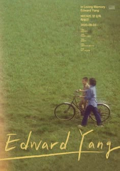 two children are playing with a bicycle in the grass and one is writing edward fangg