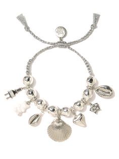 Make a splash with our Ocean Oasis bracelet. Threaded with metallic silver and accented by lustrous pearls, sparkling rhinestones, and playful shell charms, this bracelet is made for those who love to frolic on the beach (or just look like they do!). 6" Adjustable silver threadwork Drawstring closure (extendable up to 8") Silver plated brass hardware and freshwater pearls Gemstone charms Pave rhinestones Handmade in New York City and Puerto Rico. Due to the handmade nature of our products, some Adjustable Ocean-inspired Bracelet, Adjustable Ocean-inspired Bracelet For Beach Season, Adjustable Ocean-inspired Oyster Bracelet, Adjustable Silver Ocean-inspired Bracelets, Adjustable Gold Charm Bracelet Ocean-inspired, Hair Rings, Pearl Gemstone, Brass Hardware, Men Necklace