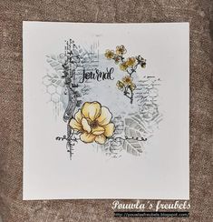 a white card with yellow flowers and the words, you're loved on it