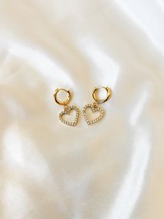 "Dainty Crystal CZ Huggie Hoop Earrings ❀❀ EARRING INFO: ❀❀ ➳ Huggie hoops are 201 stainless steel, with 316 surgical stainless steel pin ➳ Heart charm setting is gold plated brass ➳ Hoop size: 13.5mm ➳ Earring pin: 1mm ➳ Heart charm size: 15mm ❀❀ VIEW MORE EARRINGS: ❀❀ https://www.etsy.com/shop/bitsnpiecess/?section_id=23539584 ❀❀ RETURN POLICY: ❀❀ Please note that because of health/hygienic reasons, earrings cannot be returned or exchanged ❀❀ SHIPPING & PROCESSING: ❀❀ All products are MADE TO Gold Metal Hoop Earrings For Valentine's Day, Valentine's Day Gift Metal Hoop Earrings, Gold Hoop Earrings With Heart Charm, Valentine's Day Gold Pierced Huggie Earrings, Tarnish Resistant Hoop Huggie Earrings For Valentine's Day, Gold Tarnish-resistant Huggie Earrings For Valentine's Day, Gold Huggie Earrings For Valentine's Day, Valentine's Day Tarnish Resistant Hoop Huggie Earrings, Gold Hoop Earrings For Valentine's Day Gift