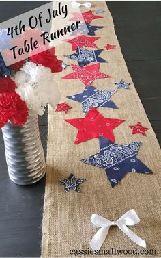 the fourth of july table runner is made with red, white and blue stars on burlap