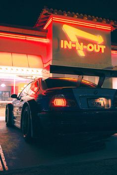 a car parked in front of a fast food restaurant