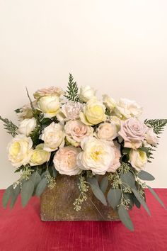 This beautiful arrangement mixes seven different varieties of white roses including Leonora, Quicksand, Patience, Purity, White Cloud, Menta, and Westminster Abbey. Tints Tones And Shades, Shades Of White, White Rose, White Roses, Floral Design, Roses, Flowers