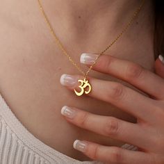 "Find your center with our 925 Sterling Silver Yoga Necklace. Imbued with spiritual significance, this inspirational Om necklace serves as a serene reminder of balance and inner peace. The Zen necklace, available in both rose and yellow gold plating, is beautifully crafted to drape elegantly, making it perfect for layering or as a standalone piece. Whether you're a yoga enthusiast or someone who cherishes spiritual symbolism, this necklace is a thoughtful gift for her, offering both beauty and m Spiritual Jewelry For Mother's Day, Spiritual Nickel-free Charm Necklaces, Spiritual Sterling Silver Charm Necklace For Mother's Day, Personalized Symbolic Jewelry For Meditation, Spiritual Pendant Charm Necklace For Mother's Day, Spiritual Adjustable Charm Necklace For Mother's Day, Adjustable Spiritual Charm Necklace For Mother's Day, Om Pendant Gold For Women, Aum Necklace