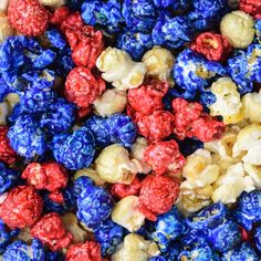 red, white and blue popcorn kernels are mixed together